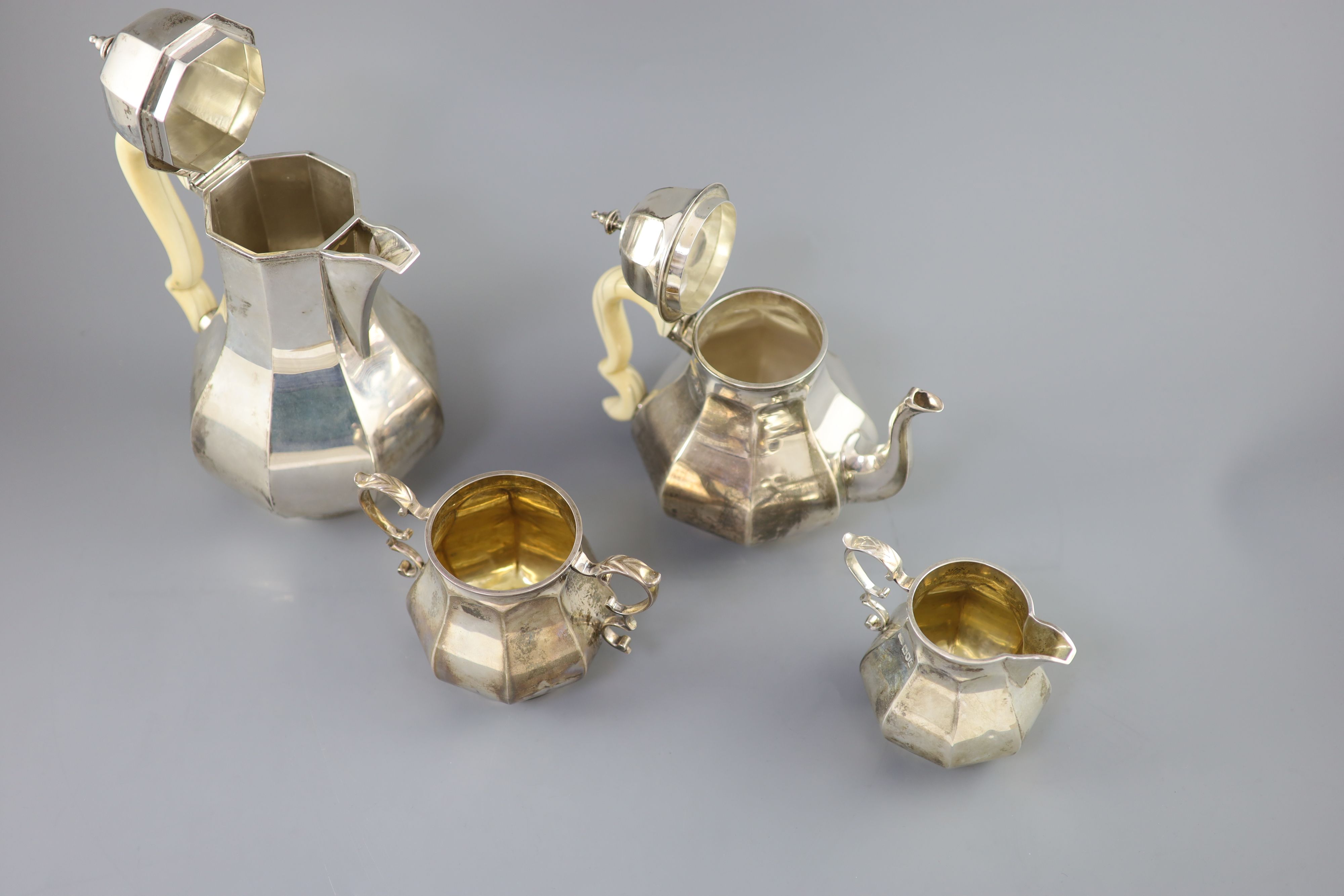 A late Victorian silver four piece Queen Anne style octagonal tea service by Elkington & Co,